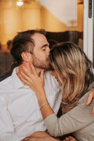 An intimate couple sharing a passionate moment together.