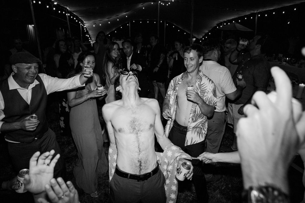 You know it's a good wedding dance party when the groom takes off his shirt