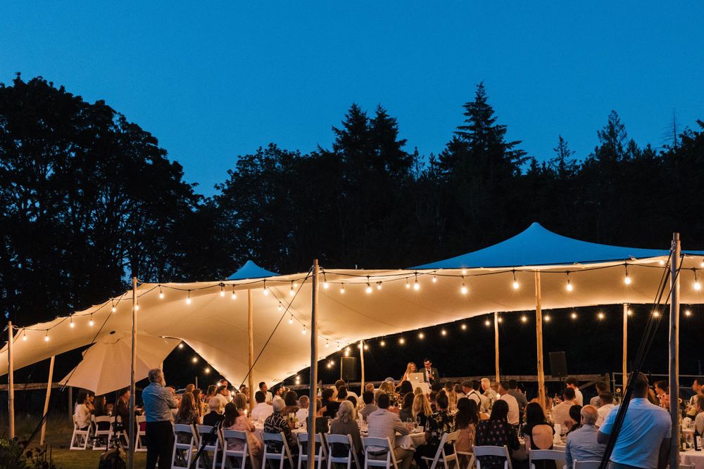 The wedding tent glowing at night
