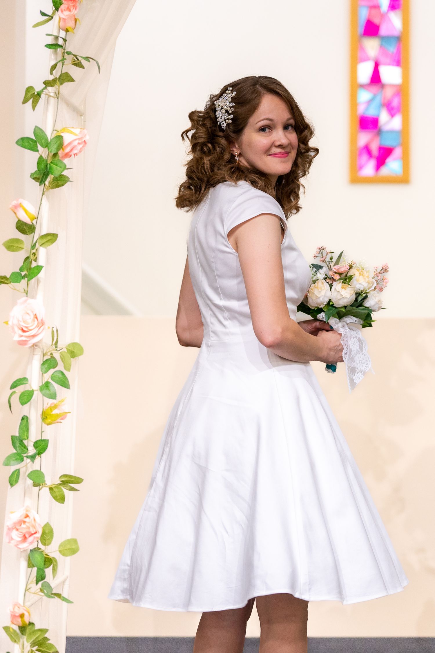 Retro Wedding, bride at alter with her bouquet.