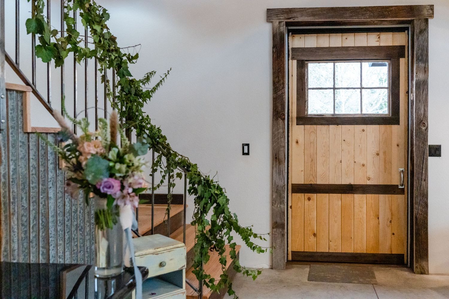 barn hall stairs going up to the balcony