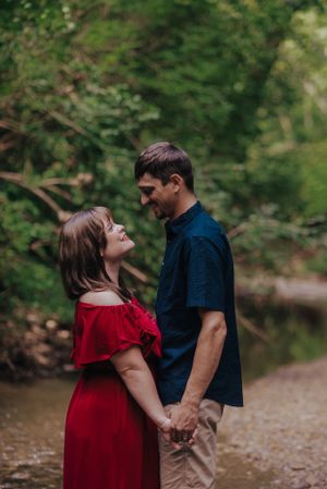 a couple standing together looking at each other