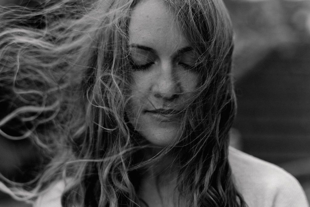ireland photographers close up portrait with her hair flying in the wind