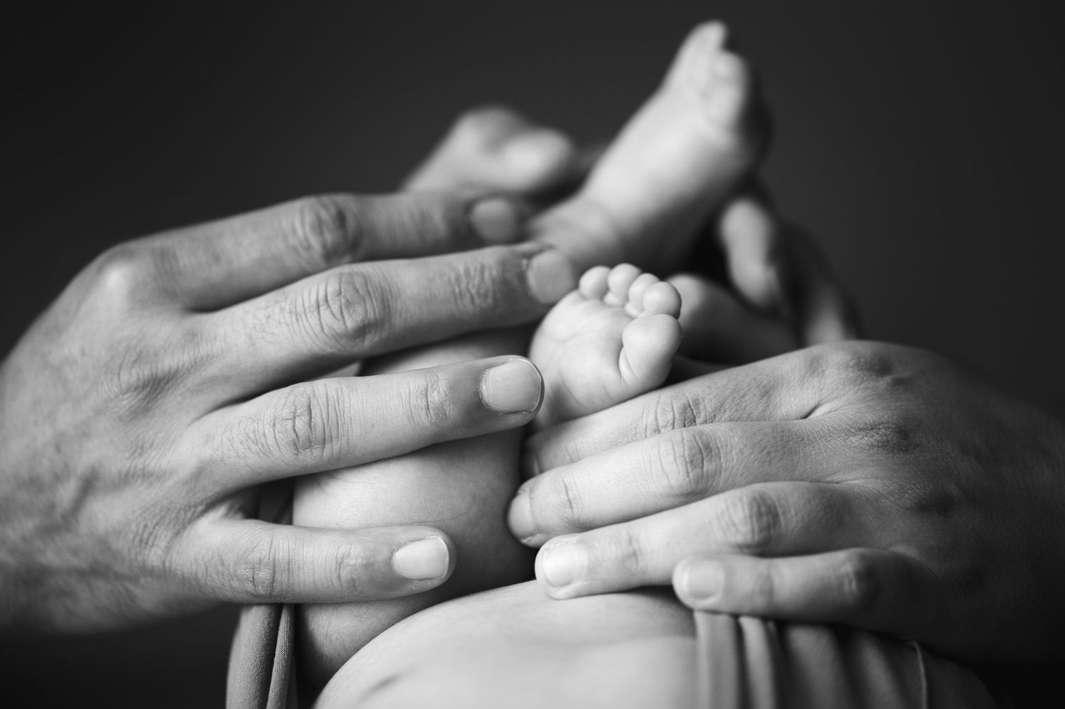 Series of intimate black and white photographs showing intertwined hands.