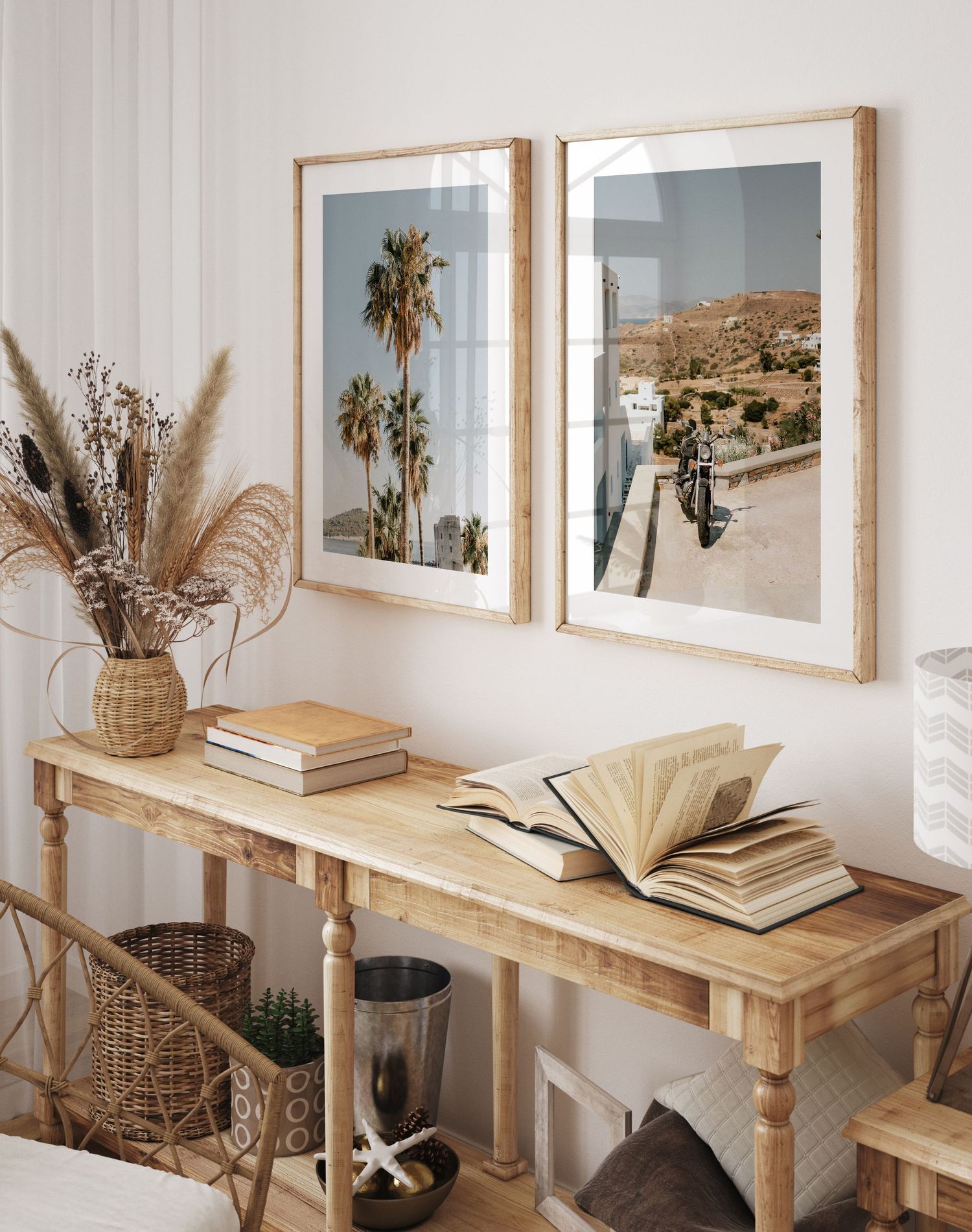 Modern coastal living room decor with framed palm tree prints and dried pampas grass on a wooden console table.