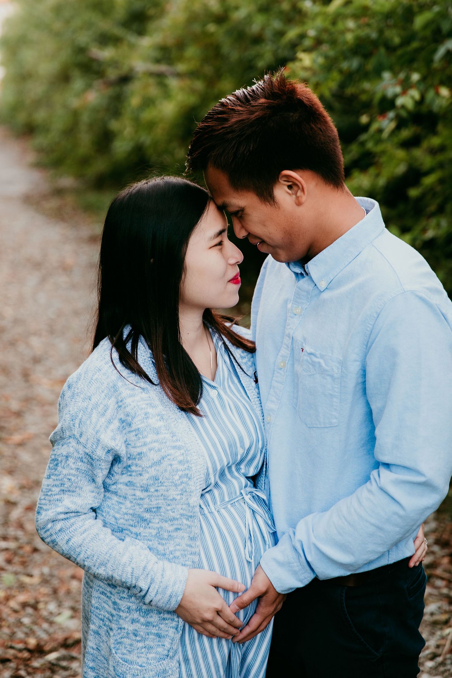 couple holding each other foreheads touching