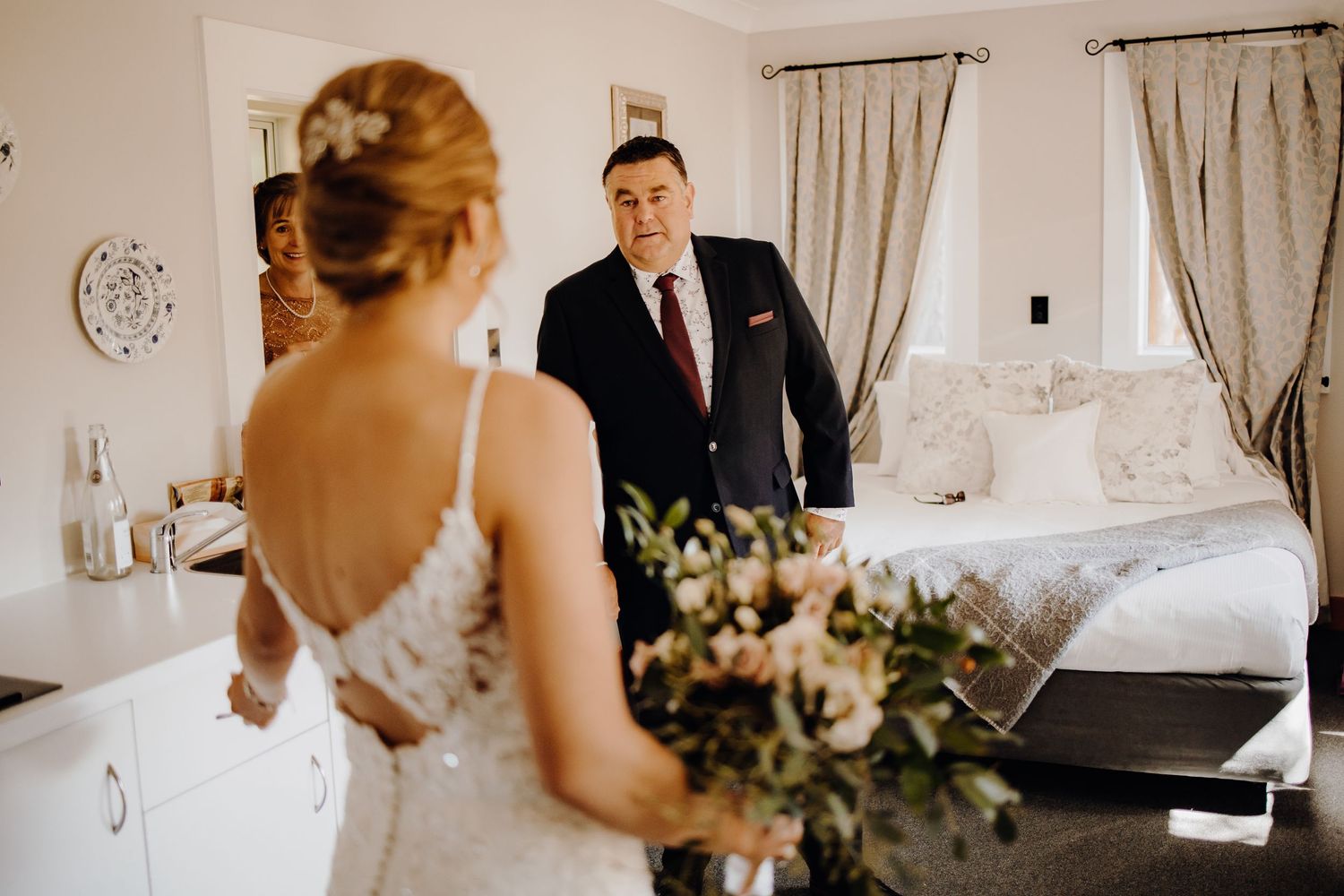Interior shots of a wedding preparation space with elegant curtains and natural lighting.