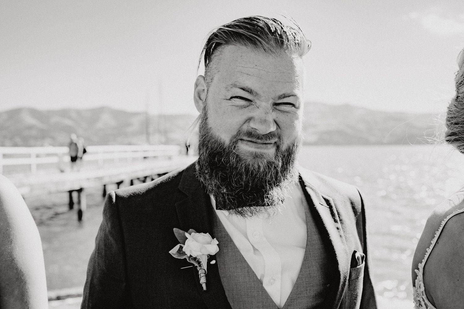 Formal wedding portraits in black and white with mountain backdrop.