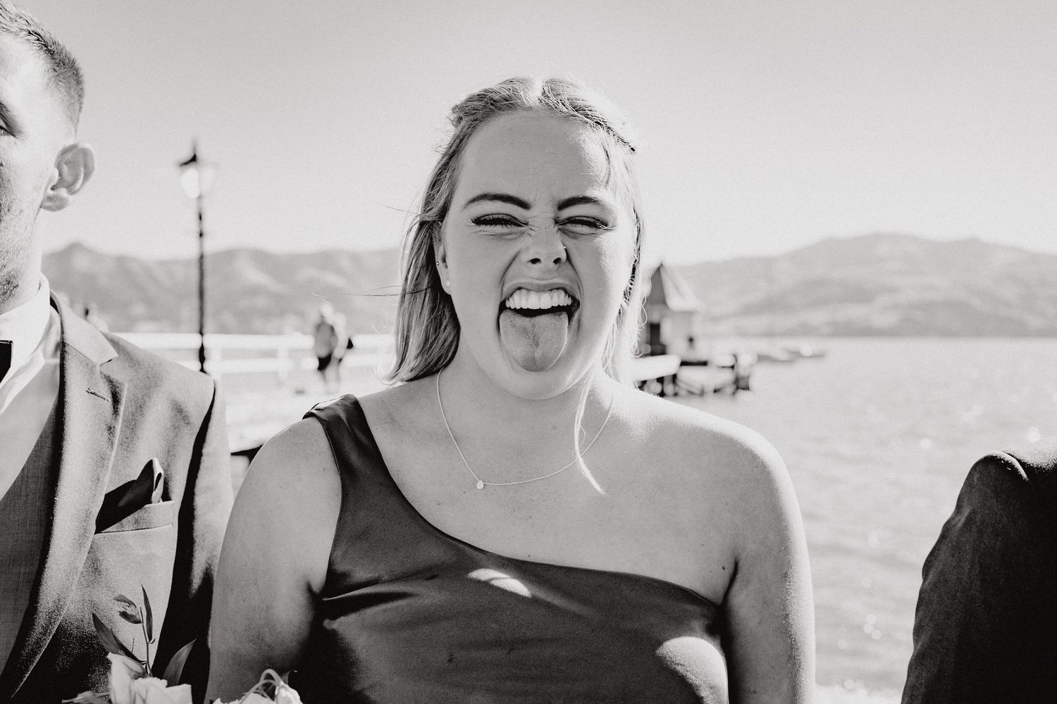 Candid black and white wedding photos showing genuine laughter and joy.