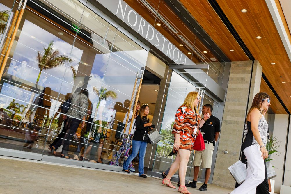 Exterior view of a Nordstrom retail store entrance with modern design elements.