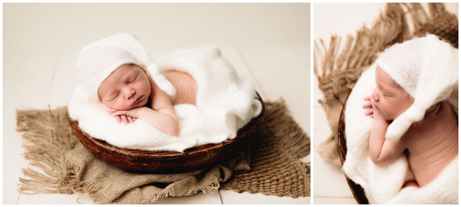 newborn sleeping on soft white blanket in wood bowl