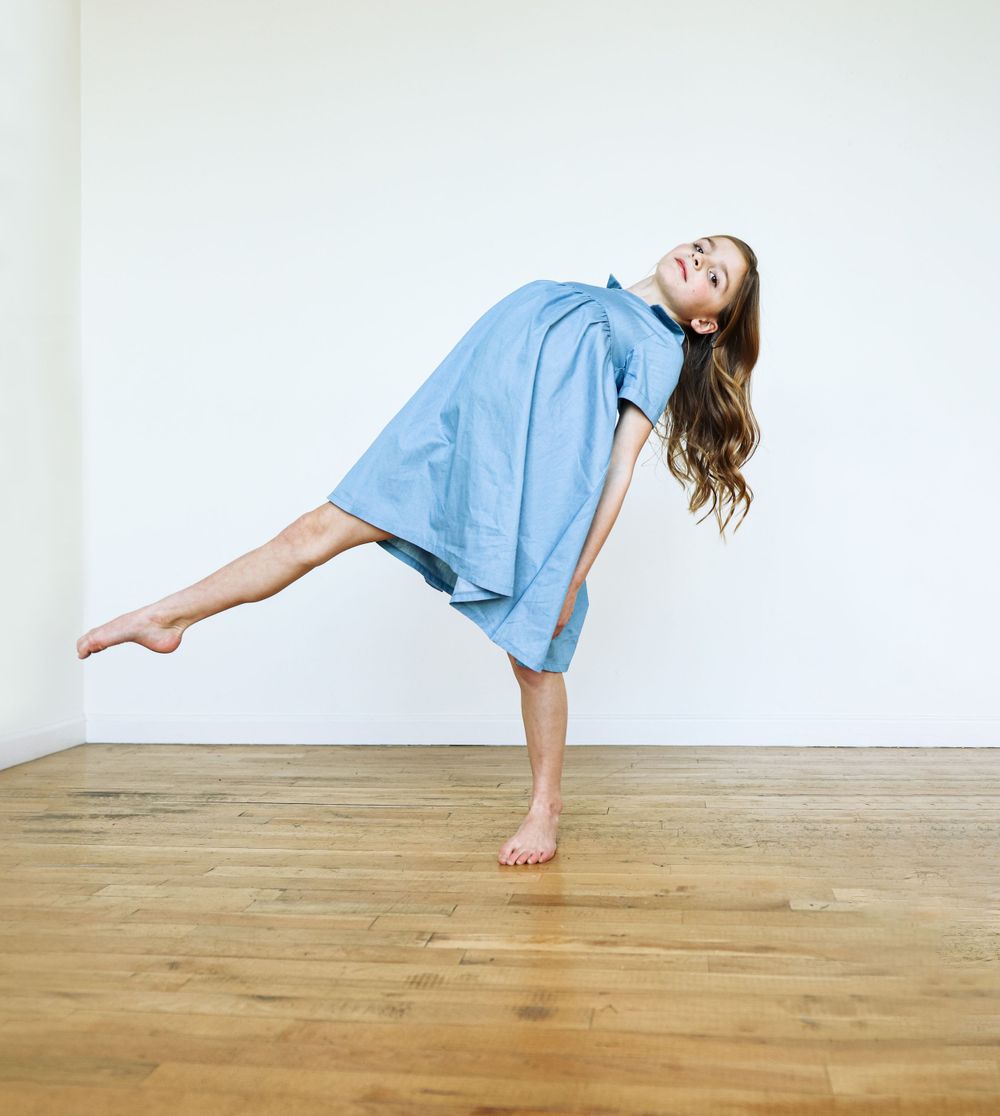 Talented girl dancing for a brand photoshoot.