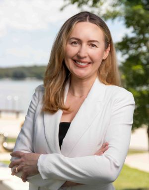 Business professional headshot with confident expression and studio lighting”