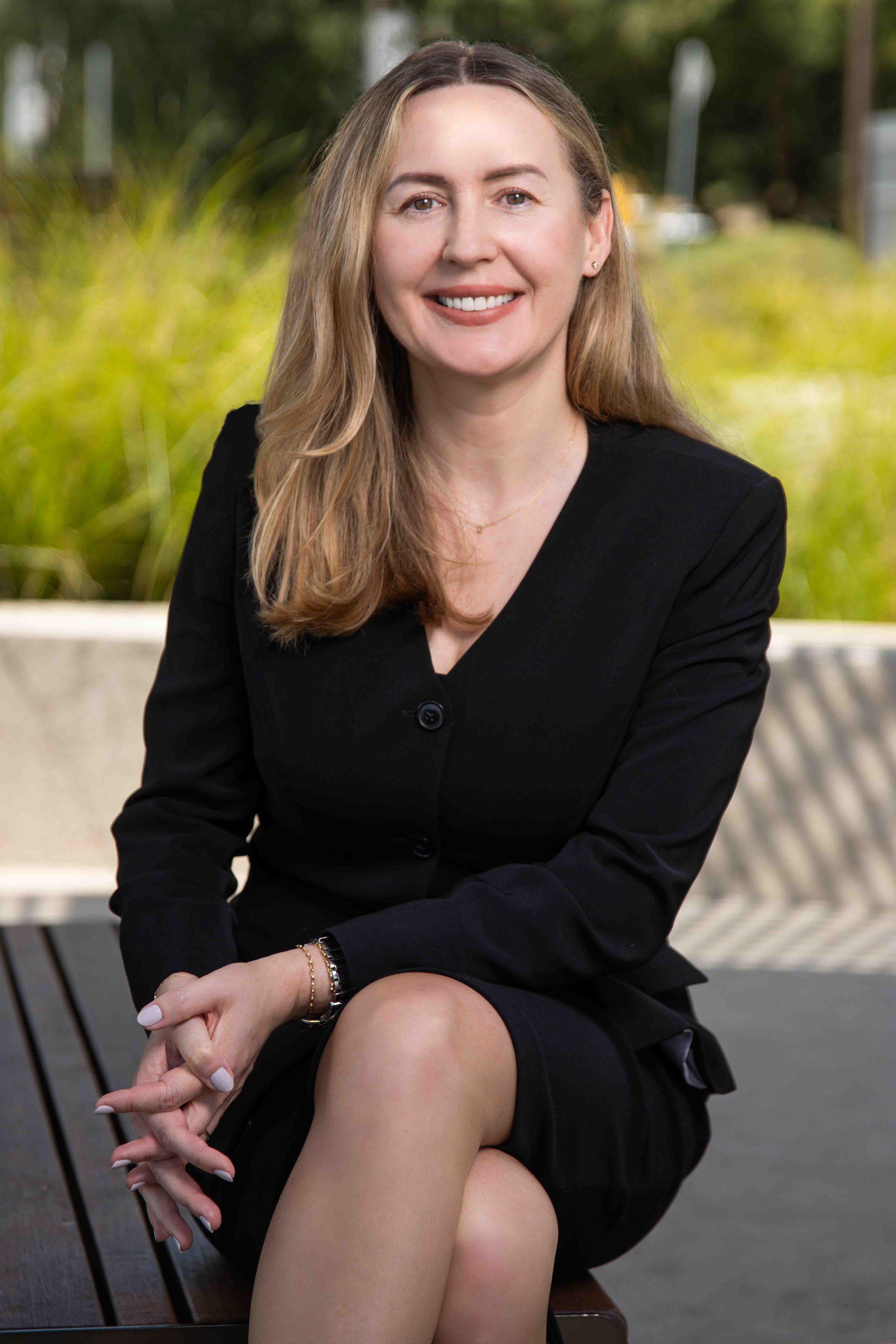 Business professional headshot with confident expression and studio lighting”