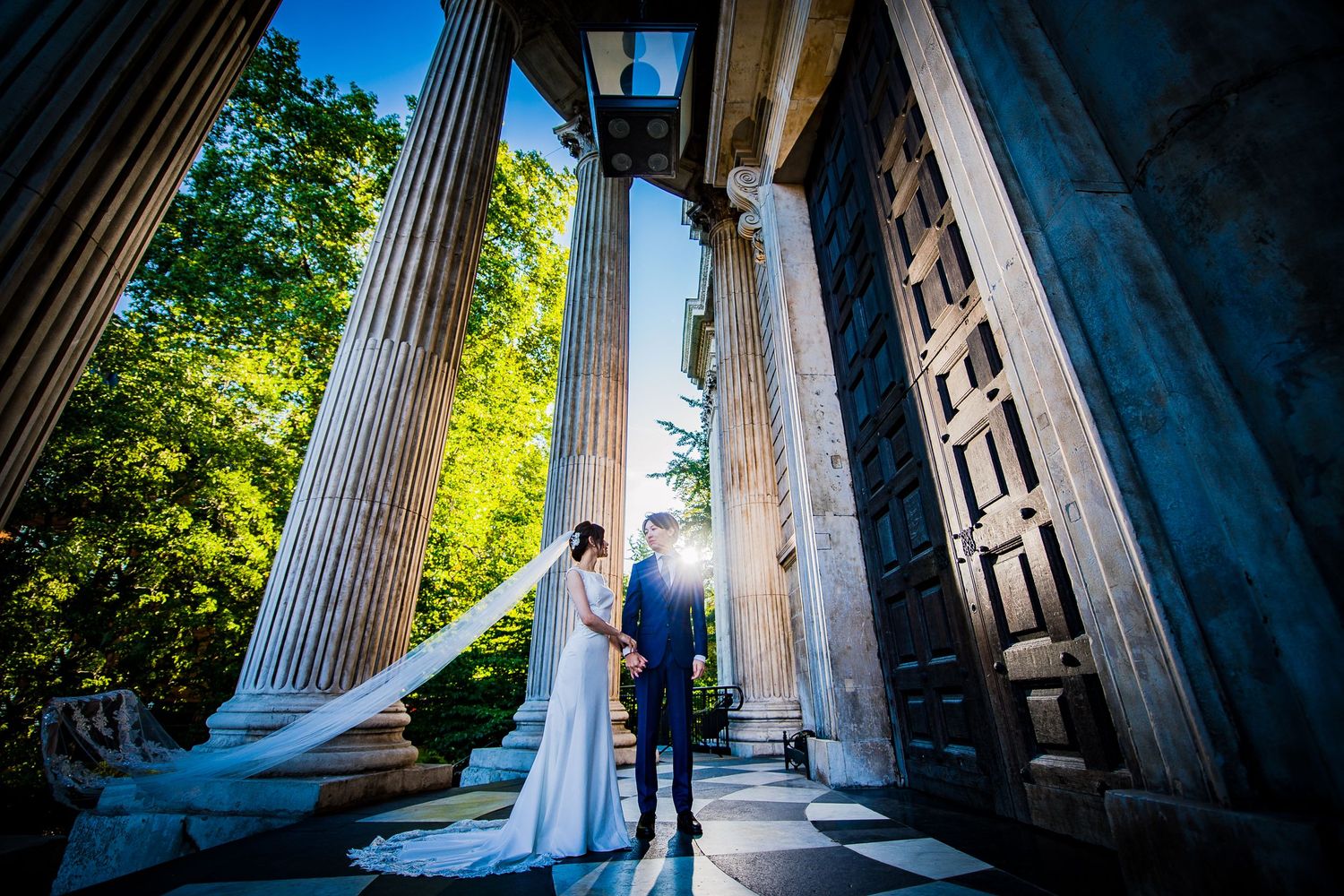 Pre-wedding in London - couple beneath the entrance to St Paul's