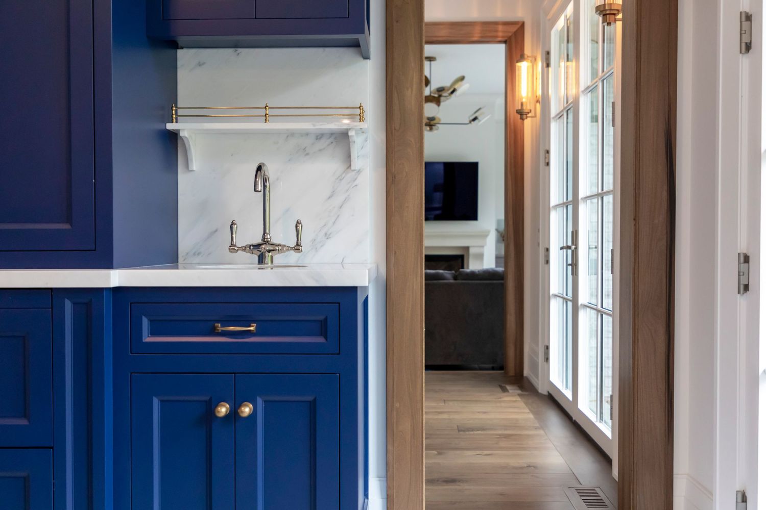 new renovation blue cabinets and brass faucet
