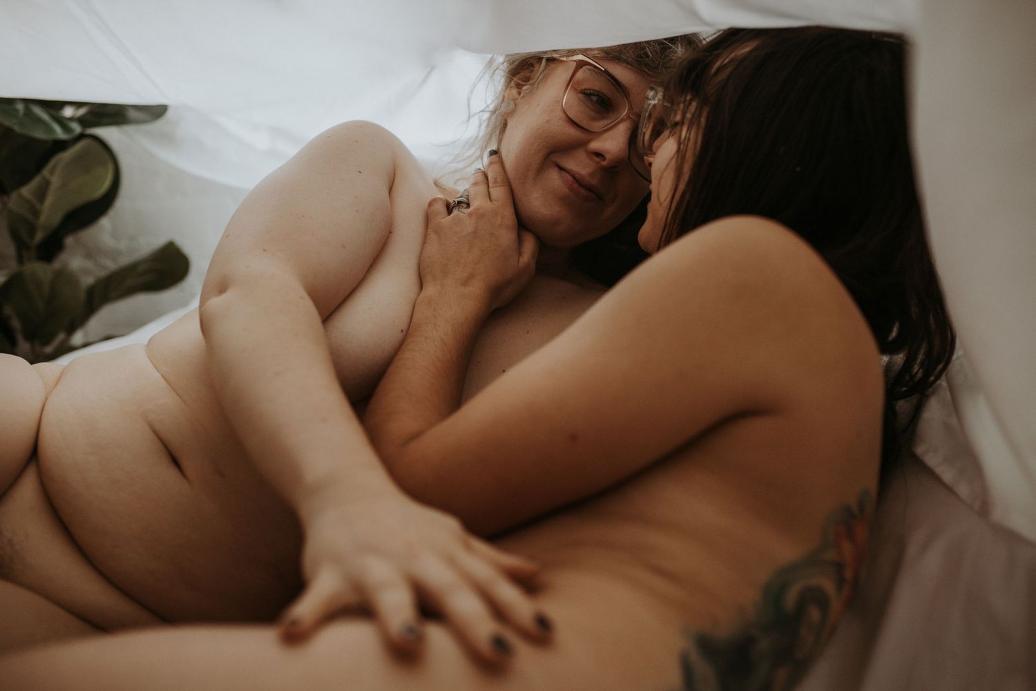 Intimate couples boudoir photography in soft natural light.