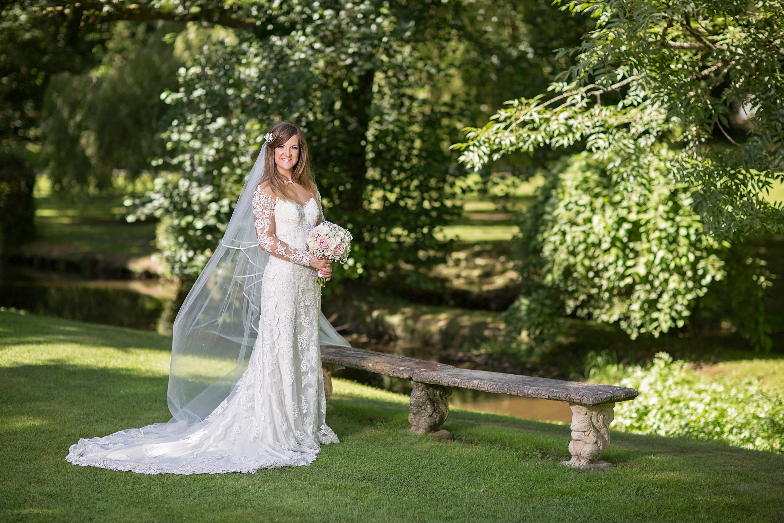 bride in the grounds at her wedding at Pencoed House