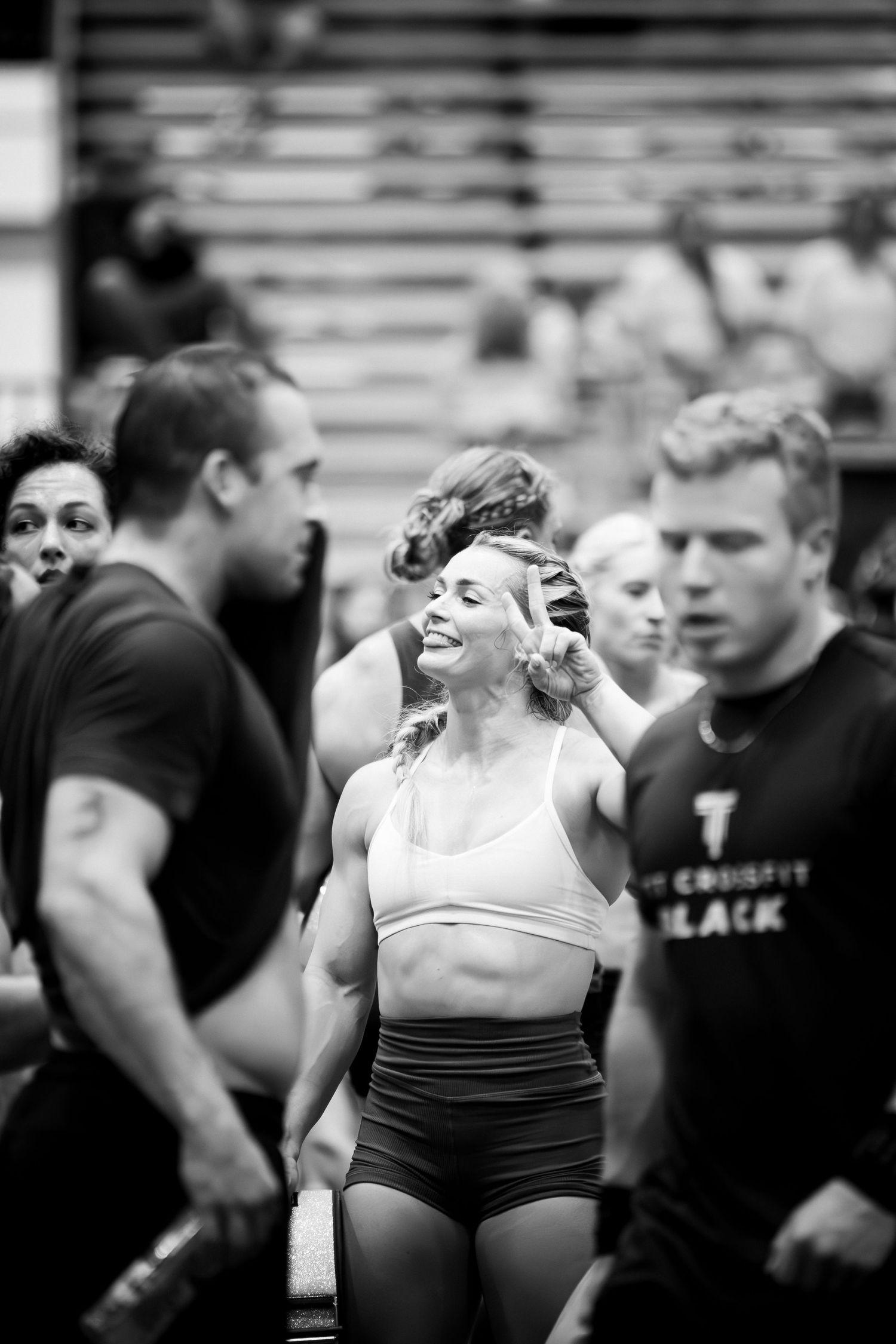 Athlete expressing intense emotion during a competitive CrossFit workout event.