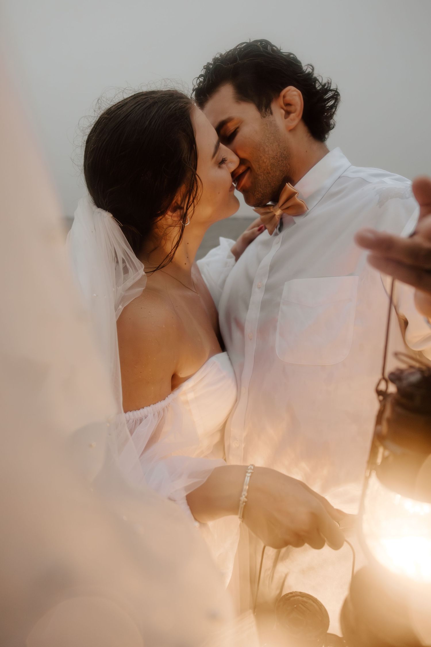 Couple eloping on the beach with lanterns taken by South Florida Elopement Photographer Lemon and Honey Co.