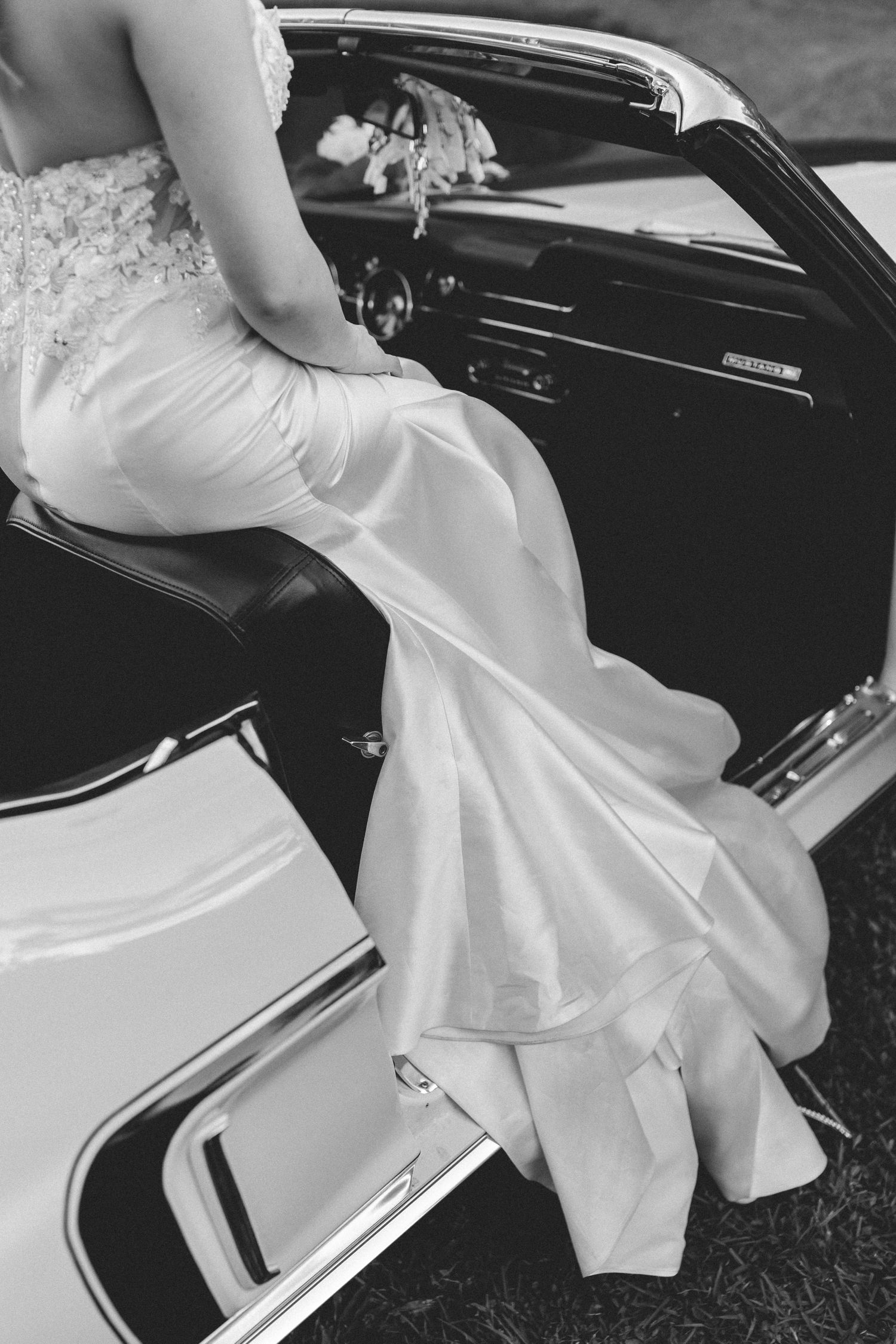 Bride sitting in vintage car taken by South Florida Wedding Photographer Lemon and Honey Co.