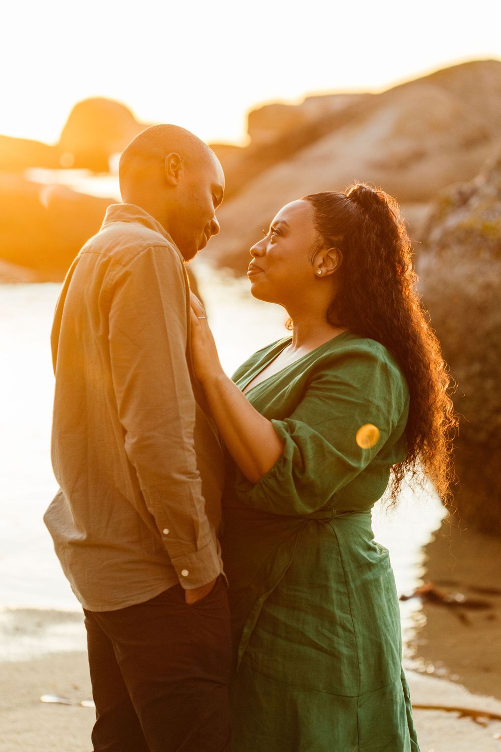 couple looking at eachoher at the beach in Camps Bay