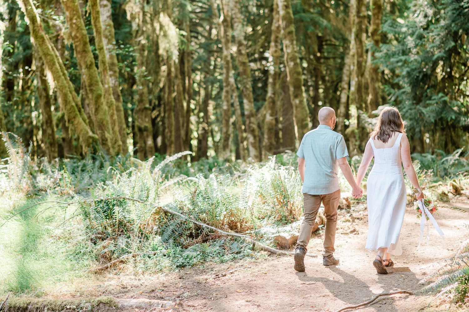 couple walking hand in hand during their elopement in Olympic National Park