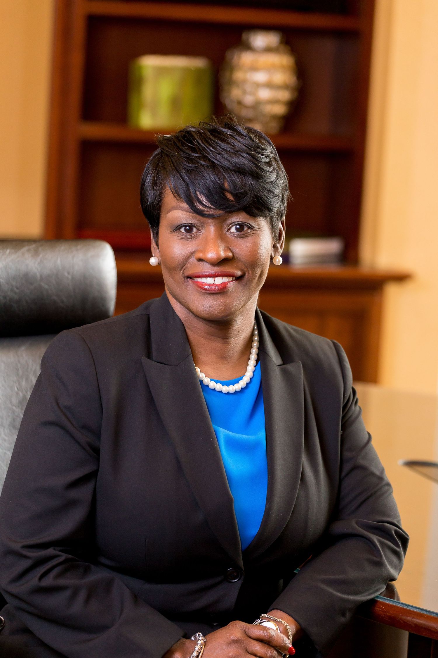Professional headshot of business woman in office by Carter Photography & Design