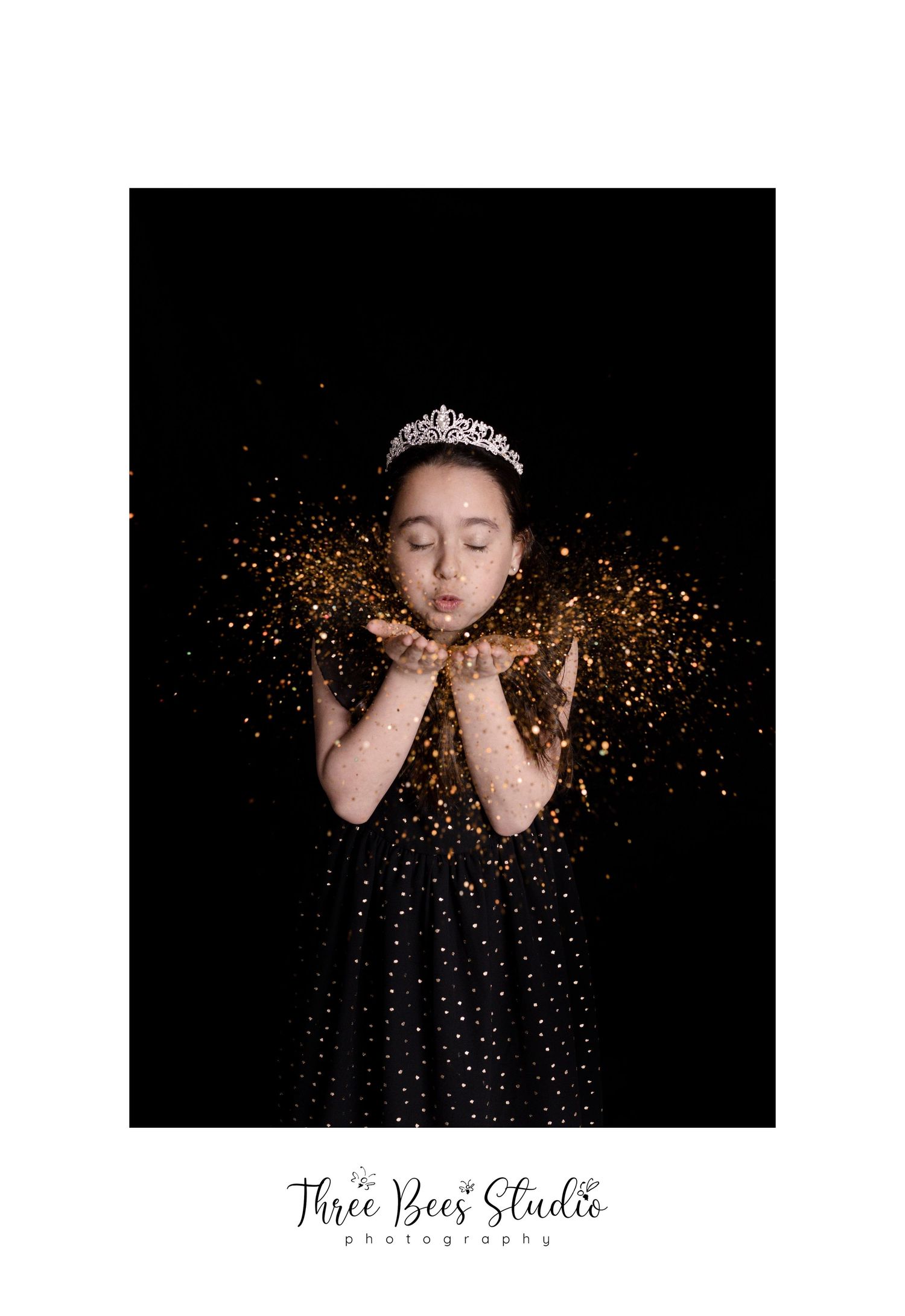 A princess-themed portrait with gold glitter and tiara against dark background.