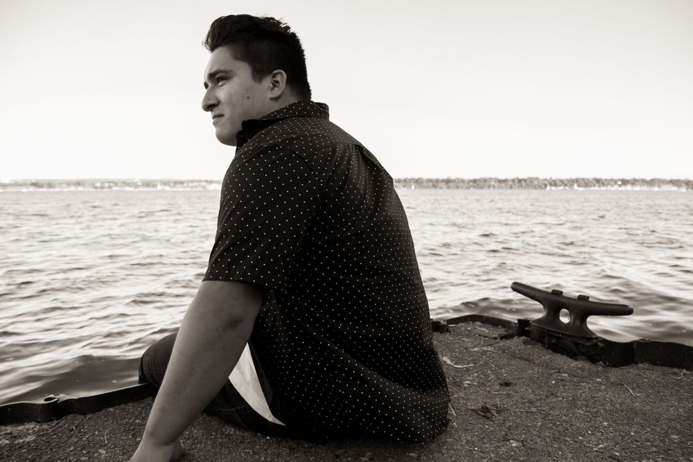 senior black and white beach presque isle guy natural light high school portrait