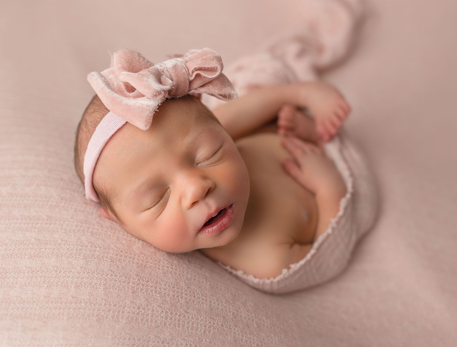 Close of baby features emphasising the precious details of early days.
