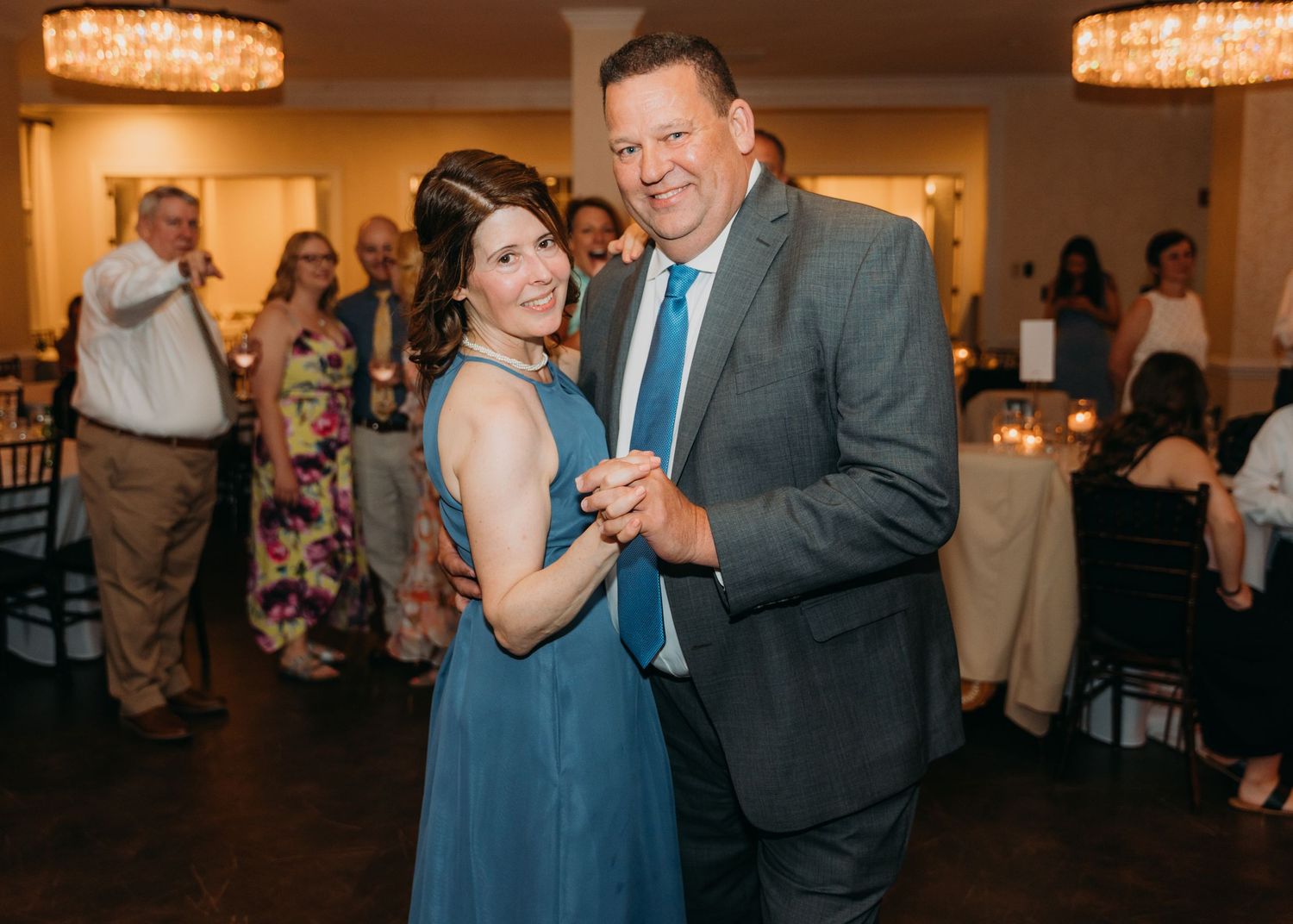 Wedding guests enjoying themselves on the dance floor during the reception.