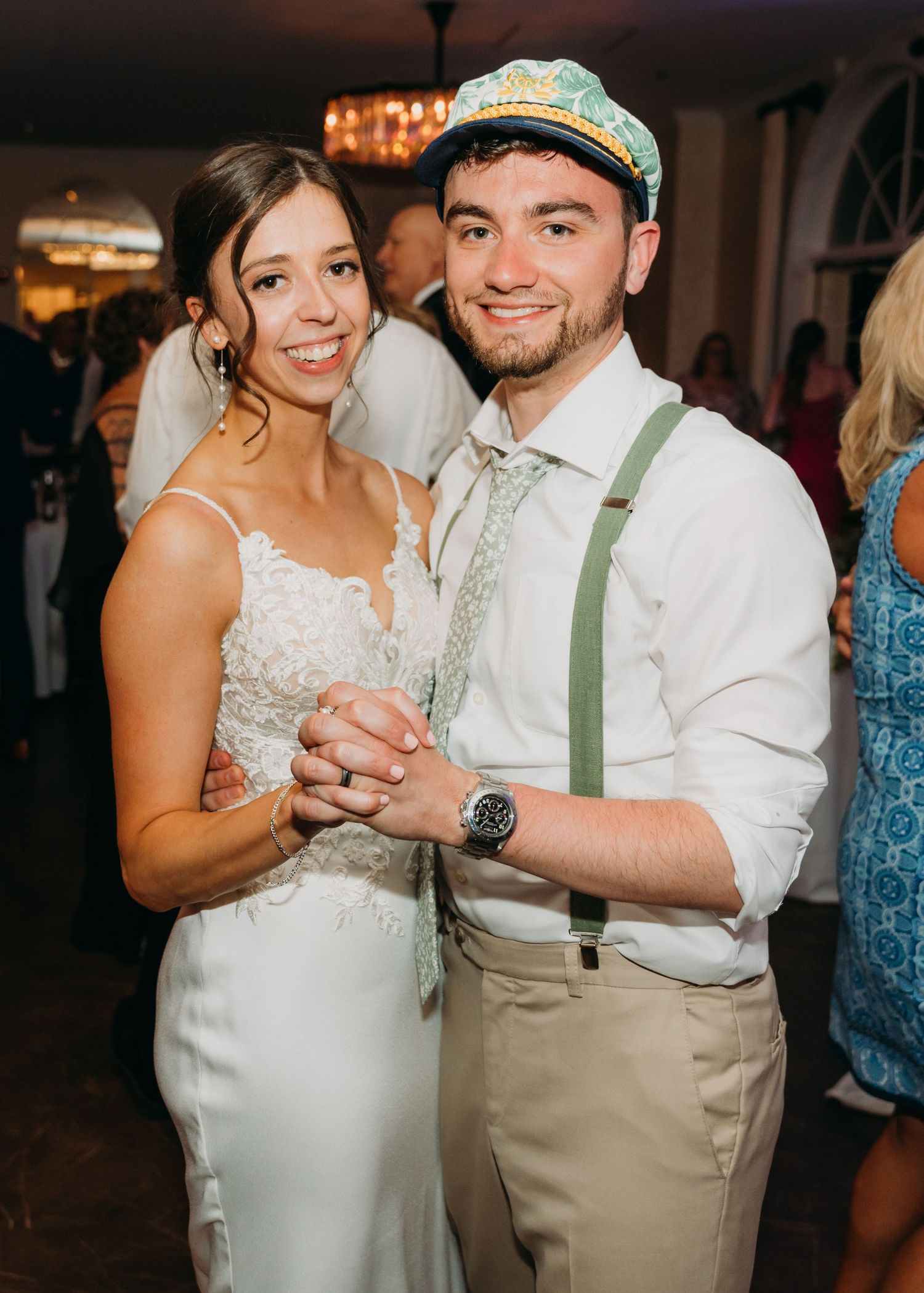 Couple sharing a romantic dance moment at their wedding reception in formal attire.