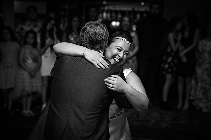 Bride & Groom laughing doing their first dance at Drayton Manor Park