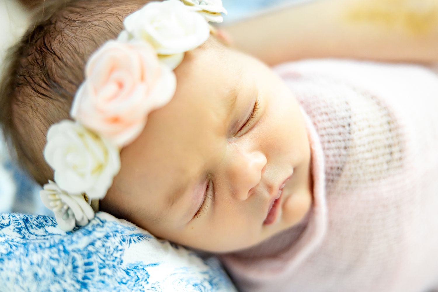 Close up of newborn baby girl's sleeping face during lifestyle newborn photos in Colorado Springs.