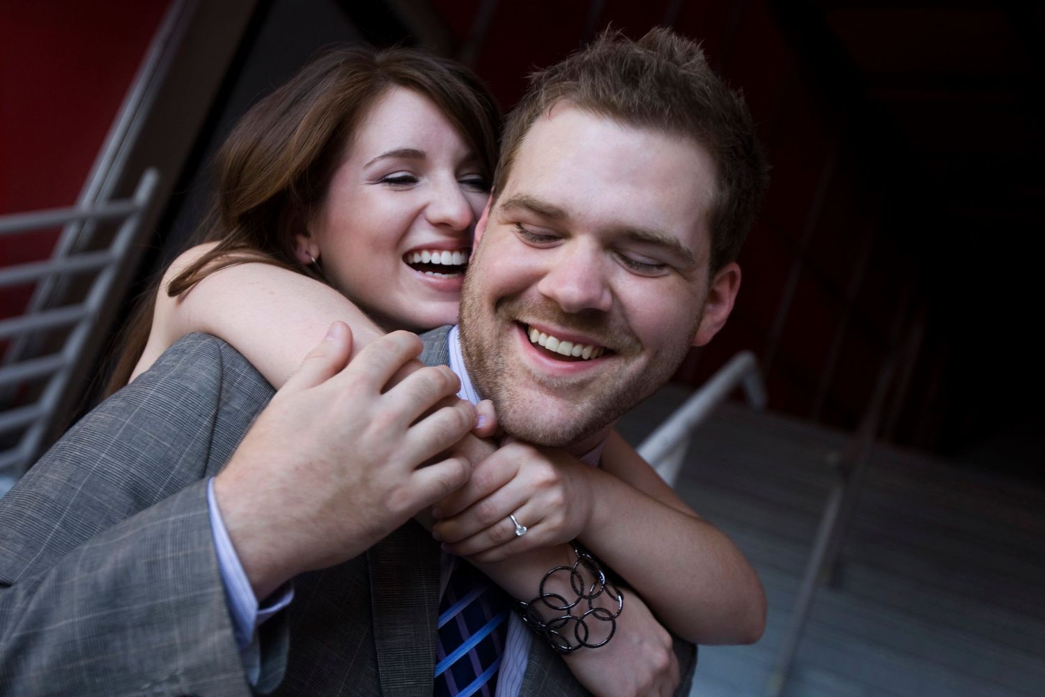 Intimate close-up engagement photos with dark moody lighting.