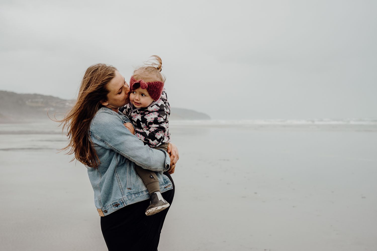 Muriwai Beach on an overcast day with Mum-to-be and her first born!