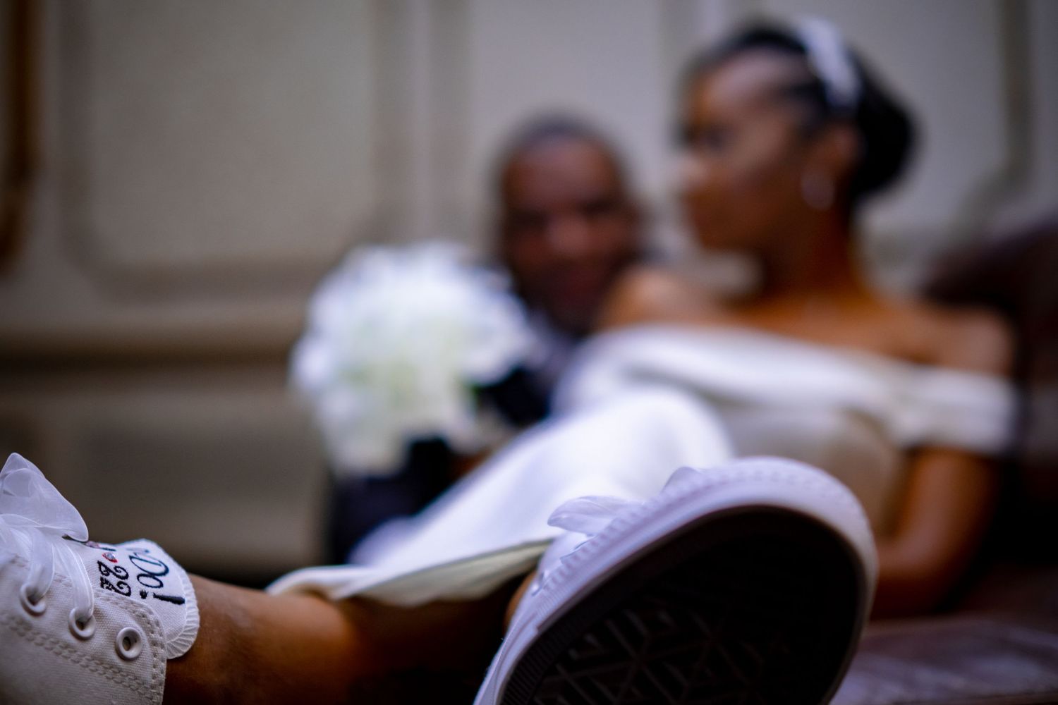 A soft focus close-up shot of wedding details during an intimate moment.
