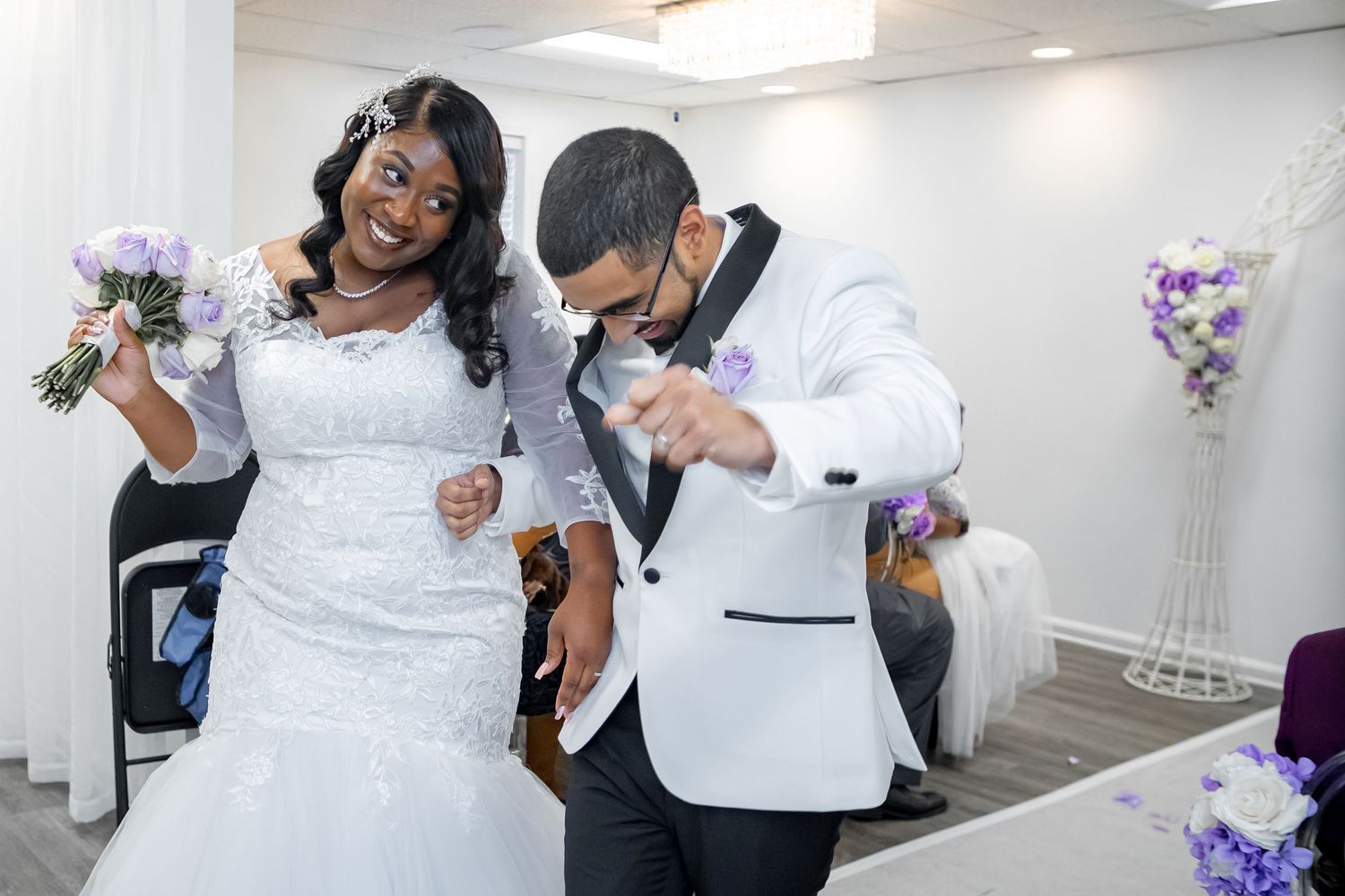 Newlyweds celebrating joyfully after their wedding ceremony.