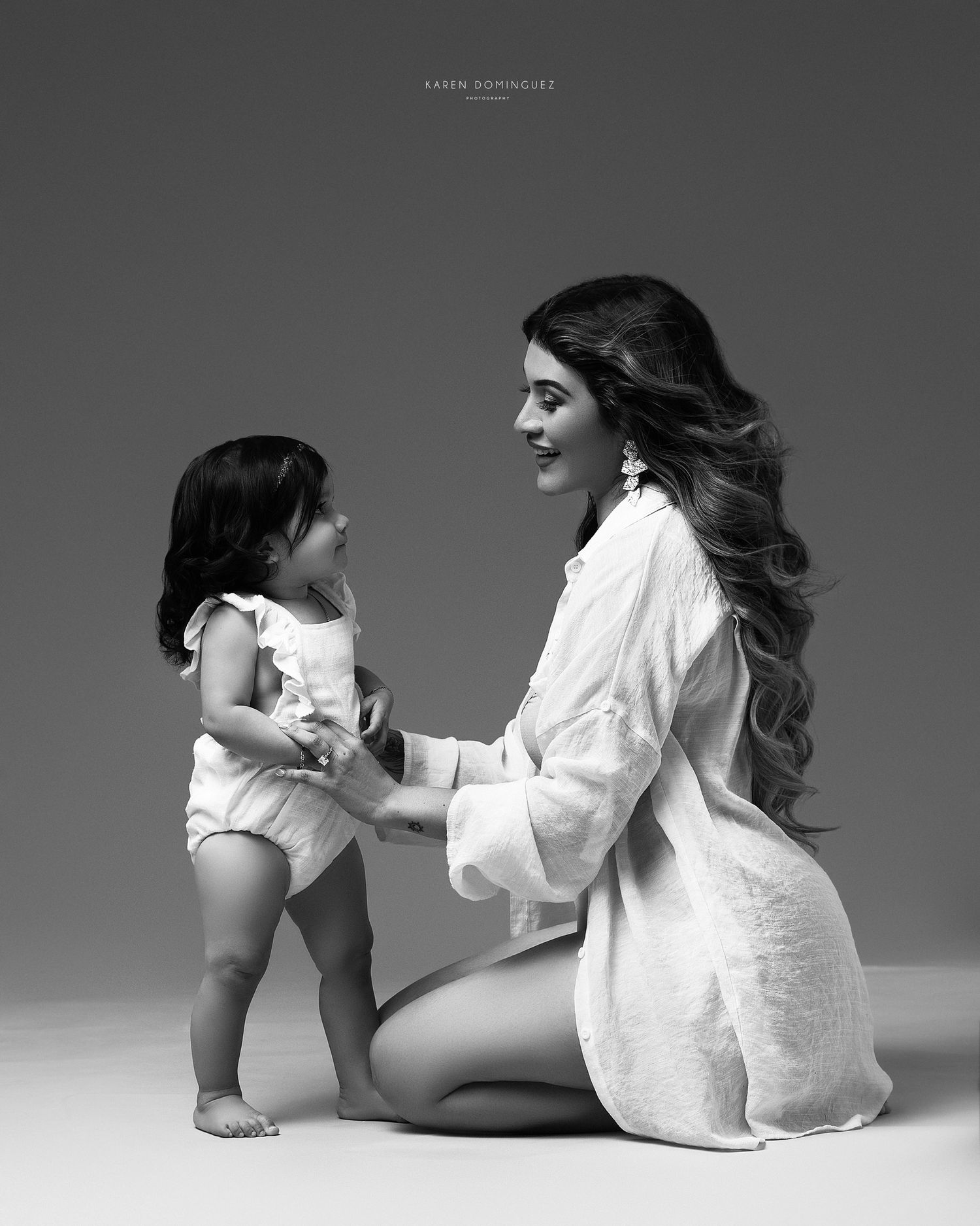 Mother interacting lovingly with a small toddler.