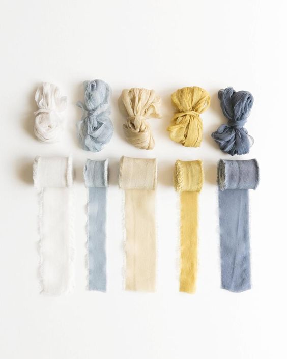 Color palette showcasing knotted fabric swatches from white through blue and yellow to grey.