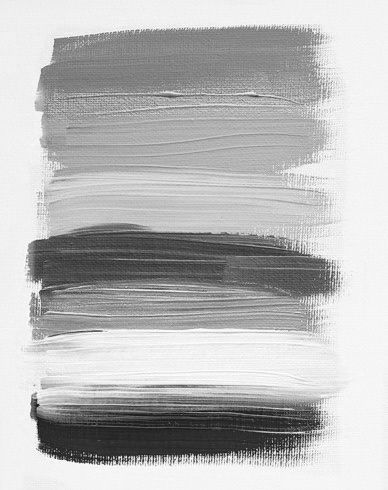 Grayscale paint brush strokes creating an ombre effect from light to dark.