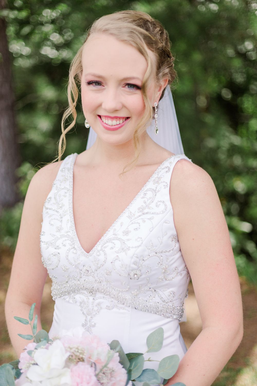 Close-up bridal portraits showing delicate lace v-neck wedding dress details and natural makeup, by best San Antonio Photographer.