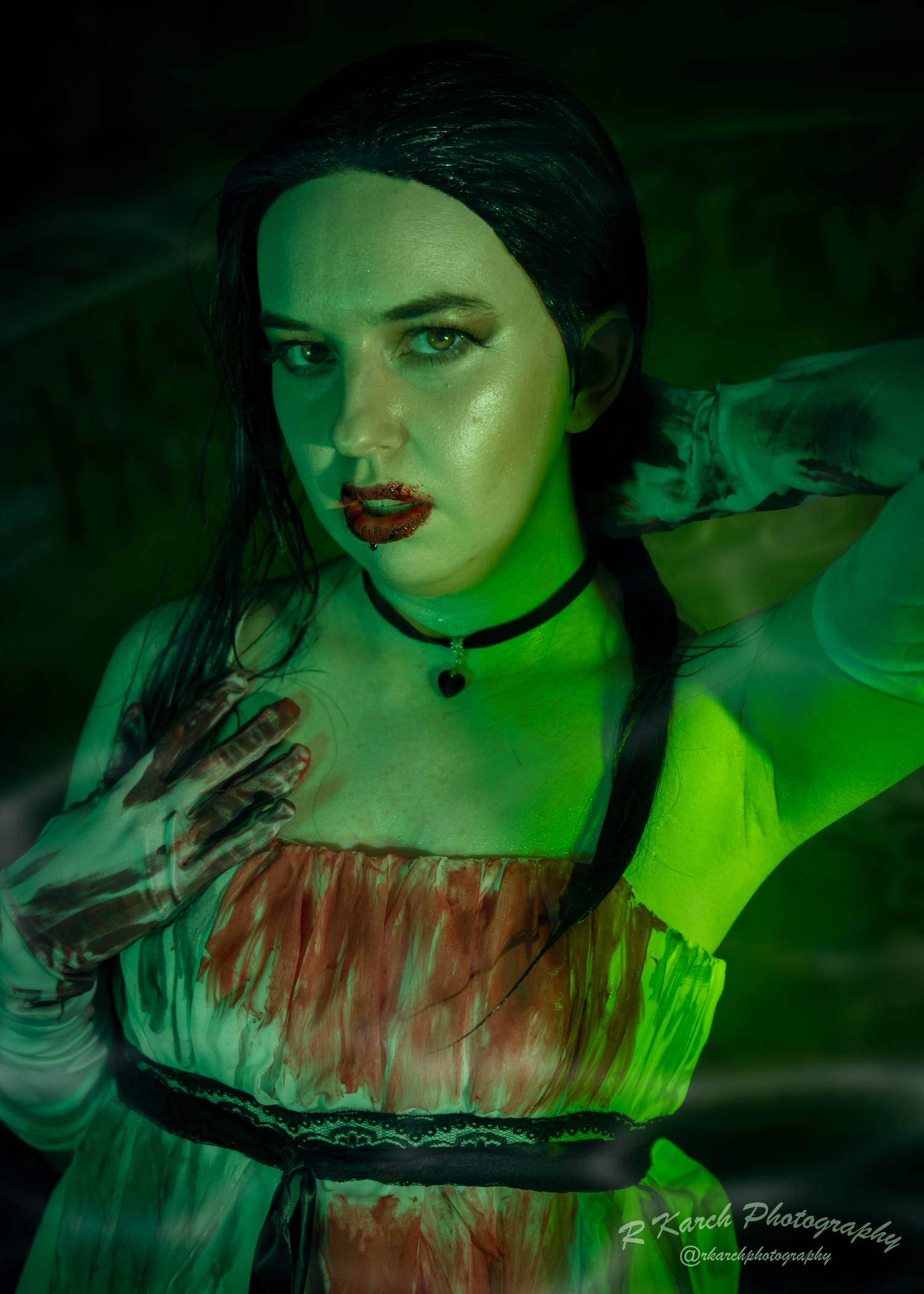 Dark fantasy portrait with neon green lighting highlighting gothic costume and dramatic makeup.