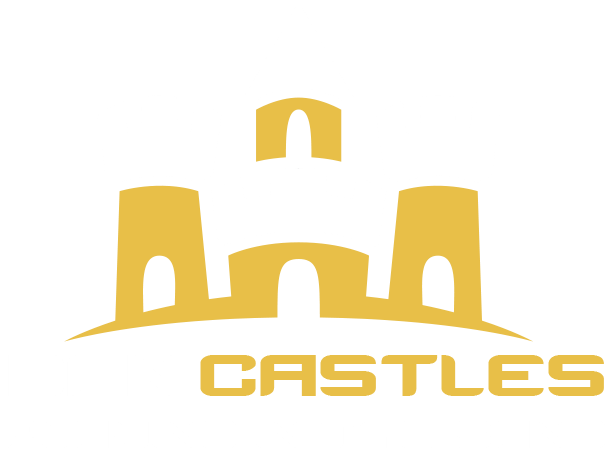 White and gold sandcastle logo design with tower turrets on black background.