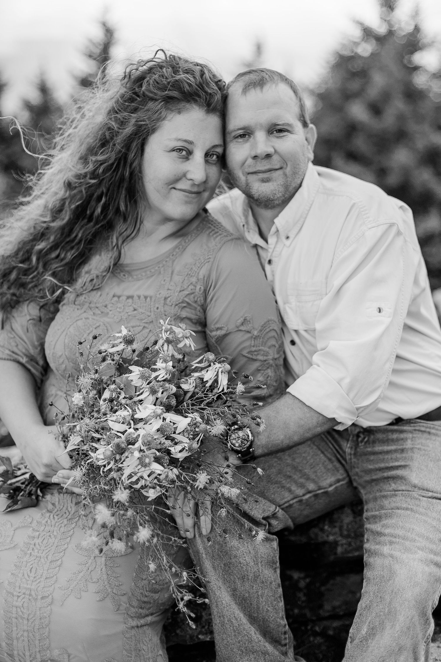 Black and white photos of couple with wildflower bouquet against mountain backdrop.