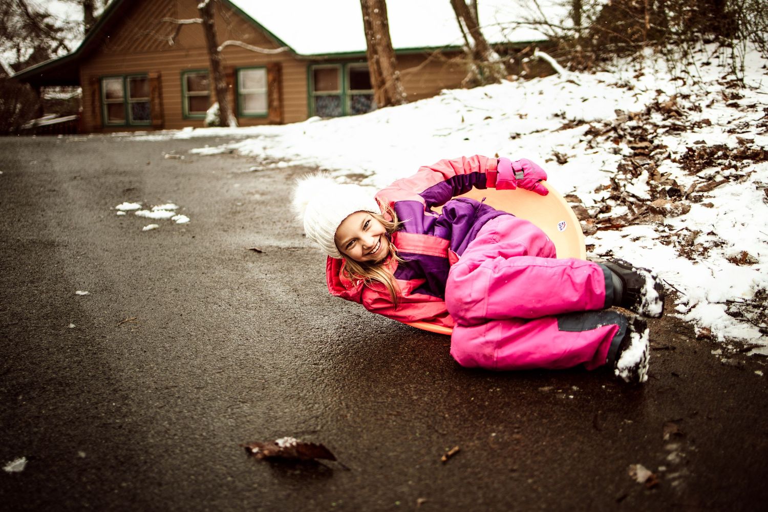 lakeland family photographer- kid on a sled