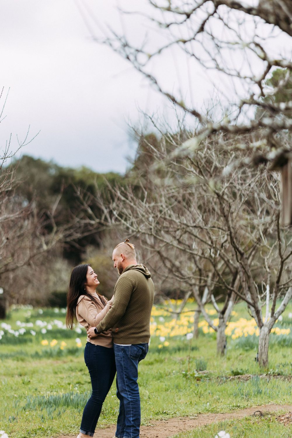 Engagement photos with daffodils blooming at Filoli