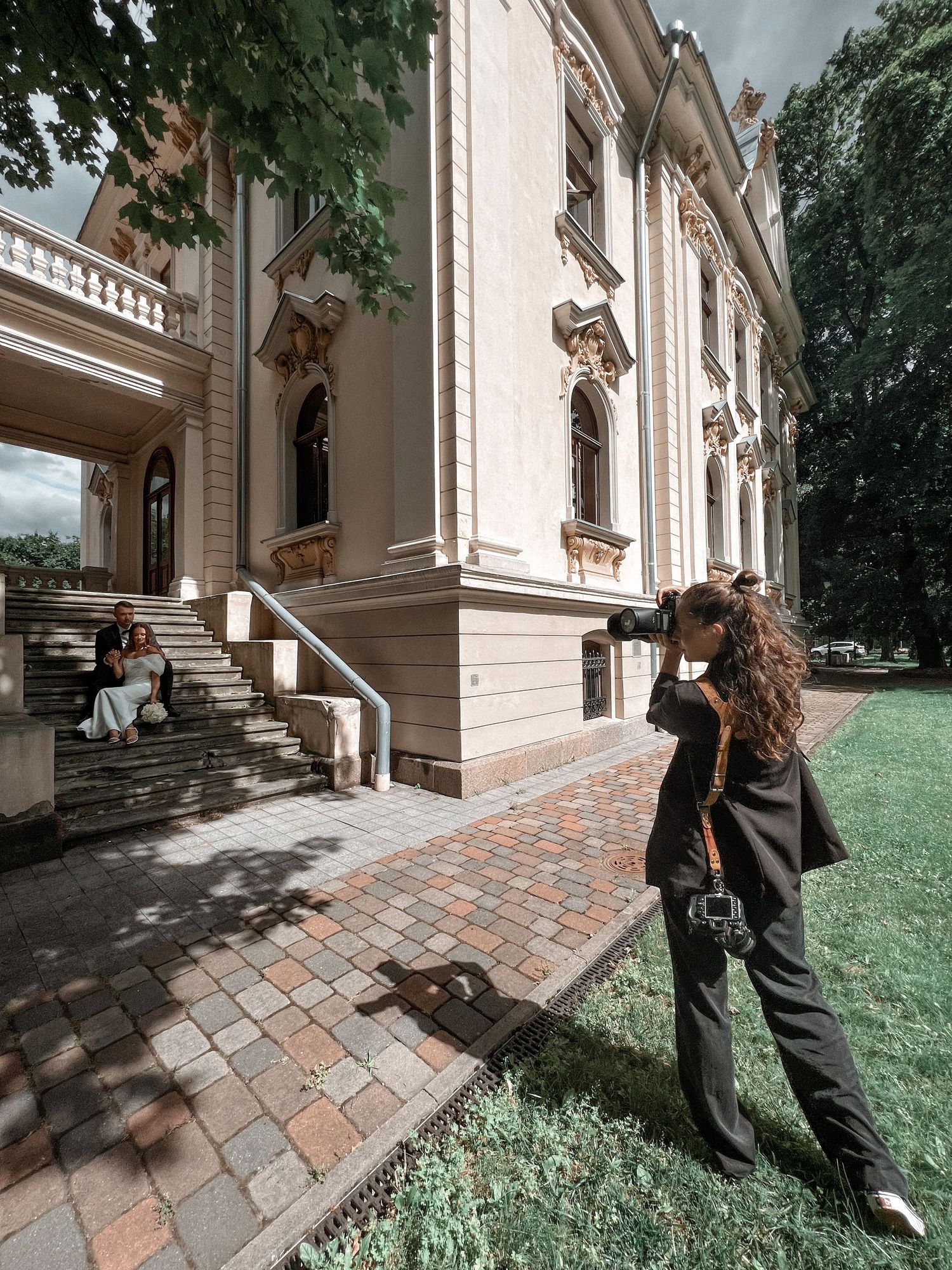 Wedding photographer capturing amazing couple near the old palace in Vilnius
