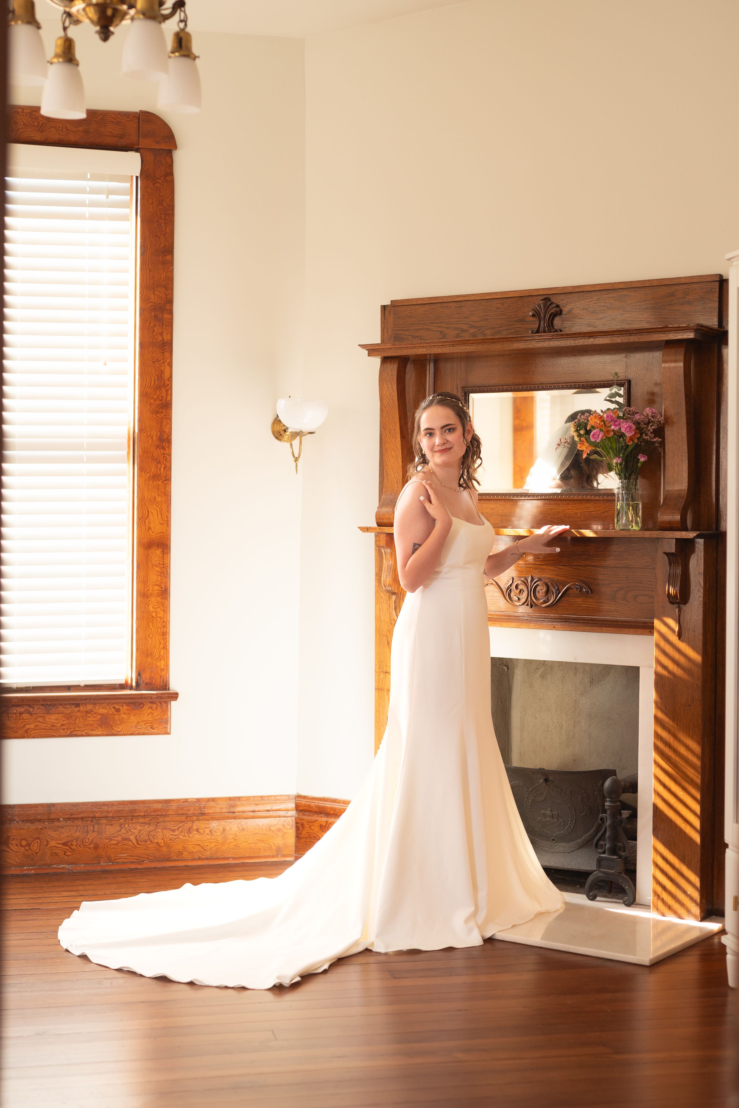 Elegant bridal preparation room with wooden trim and natural lighting.
